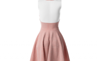 the back of an orange dress on a mannequin